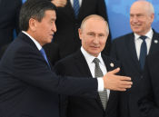 Kyrgyz President Sooronbay Jeenbekov, left, and Russian President Vladimir Putin prepare to pose for a family photo during the Shanghai Cooperation Organization (SCO) summit, in Bishkek, Kyrgyzstan